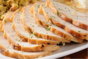 Sliced Turkey and gravy with mashed potatos and stuffing